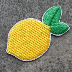 Het geborduurde embleem Citroen