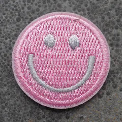 Het geborduurde embleem Smiley Roze